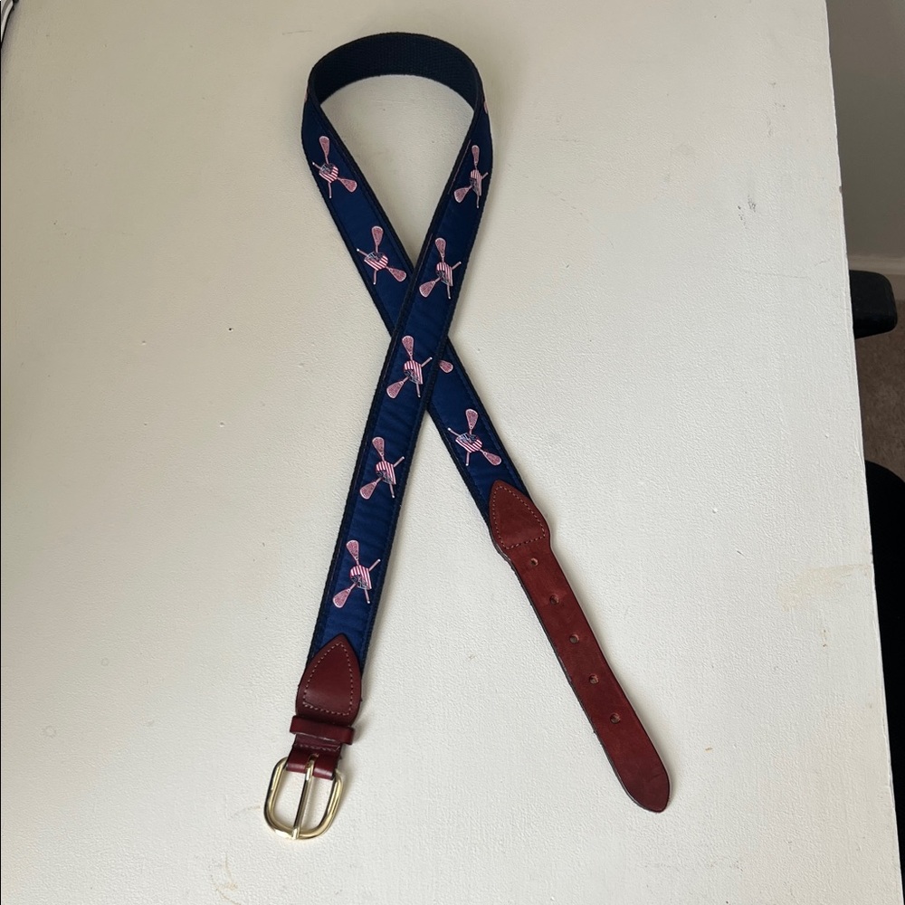 Stylish Navy and Red Men’s Belt with red white and blue lacrosse helmet and stix